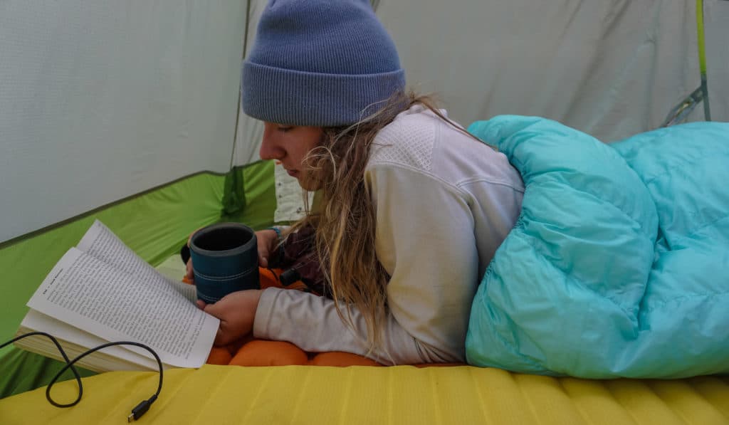 Reading a book in the tent